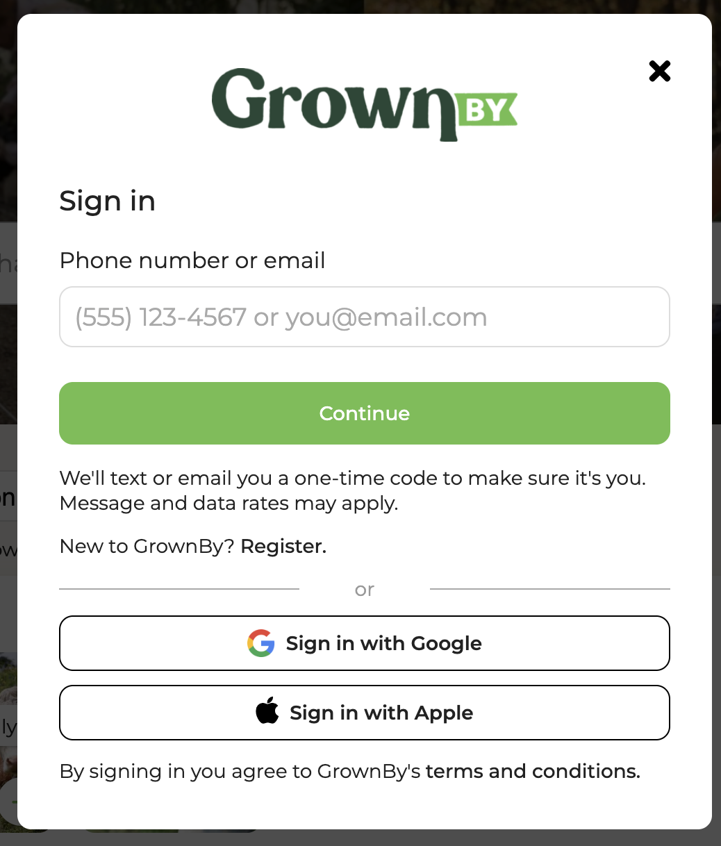GrownBy sign-in screen with a phone number or email field, a Continue button, and options to sign in with Google or Apple